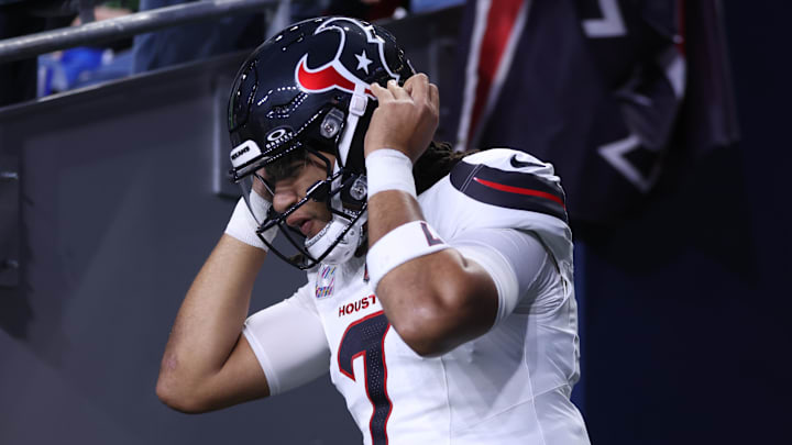 Oct 20, 2025; Seattle, Washington, USA; Houston Texans quarterback C.J. Stroud (7) runs onto the field for warmups prior to the game against the Seattle Seahawks at Lumen Field. Mandatory Credit: Kevin Ng-Imagn Images
