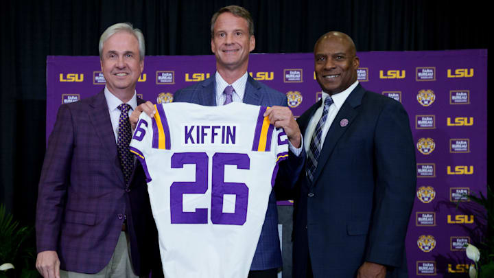 Dec 1, 2025; Baton Rouge, LA, USA; LSU president Wade Rousse, left, LSU new head coach Lane Kiffin and LSU athletic director Verge Ausberry stand together at South Stadium Club at Tiger Stadium. Mandatory Credit: Matthew Hinton-Imagn Images
