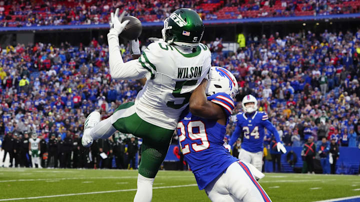 Dec 29, 2024; Orchard Park, New York, USA; New York Jets wide receiver Garrett Wilson (5) make a catch for a touchdown against Buffalo Bills cornerback Dee Delaney (29) during the second half at Highmark Stadium. Mandatory Credit: Gregory Fisher-Imagn Images Dec 29, 2024; Orchard Park, New York, USA; New York Jets wide receiver Garrett Wilson (5) make a catch for a touchdown against Buffalo Bills cornerback Dee Delaney (29) during the second half at Highmark Stadium. Mandatory Credit: Gregory Fisher-Imagn Images