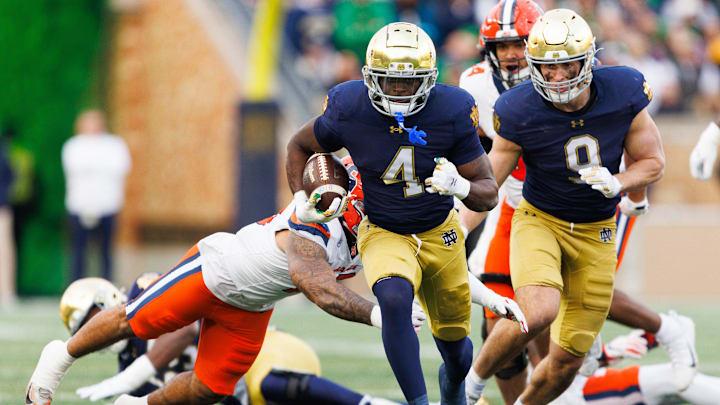 Notre Dame running back Jeremiyah Love (4) runs with the ball on his way to score a touchdown in the first half of a NCAA football game against Syracuse at Notre Dame Stadium on Saturday, Nov. 22, 2025, in South Bend.