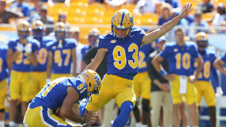 Aug 30, 2025; Pittsburgh, Pennsylvania, USA; Pittsburgh Panthers place kicker Trey Butkowski (93) kicks a field goal from the hold of punter Caleb Junko (91) against the Duquesne Dukes during the fourth quarter at Acrisure Stadium. Mandatory Credit: Charles LeClaire-Imagn Images