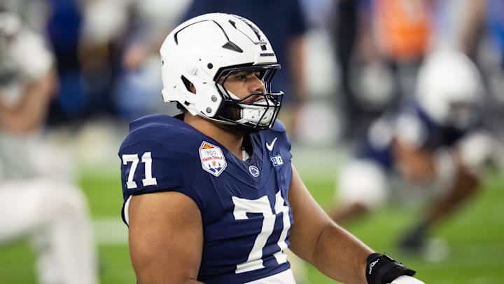 Dec 31, 2024; Glendale, AZ, USA; Penn State Nittany Lions offensive lineman Olaivavega Ioane (71) against the Boise State Broncos during the Fiesta Bowl at State Farm Stadium. Mandatory Credit: Mark J. Rebilas-Imagn Images