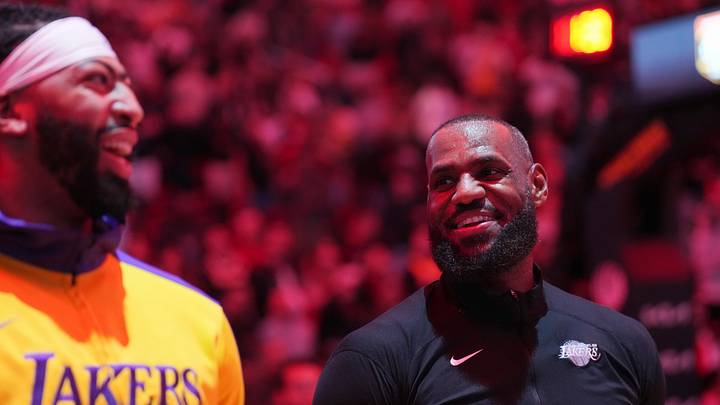 Los Angeles Lakers forward LeBron James, right, and forward Anthony Davis during pregame ceremonies before a game against the Miami Heat at Kaseya Center. Mandatory Credit: Jim Rassol-Imagn Images