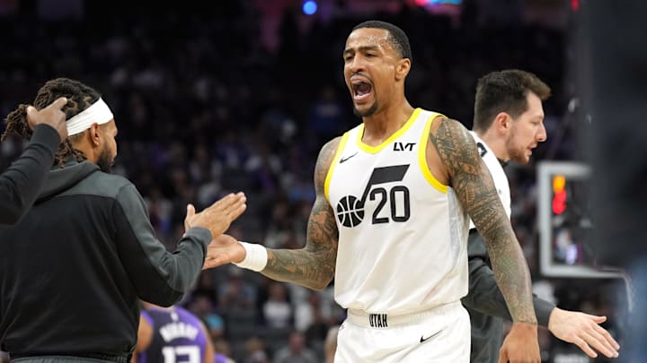 Dec 8, 2024; Sacramento, California, USA; Utah Jazz forward John Collins (20) slaps hands with guard Patty Mills (left) during the third quarter against the Sacramento Kings at Golden 1 Center. Mandatory Credit: Darren Yamashita-Imagn Images