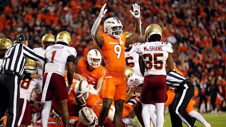 Oct 17, 2024; Blacksburg, Virginia, USA; Virginia Tech Hokies wide receiver Da'Quan Felton (9) celebrates after a quarterback Kyron Drones (1) scored a touchdown during the first quarter against the Boston College Eagles at Lane Stadium. Mandatory Credit: Peter Casey-Imagn Images