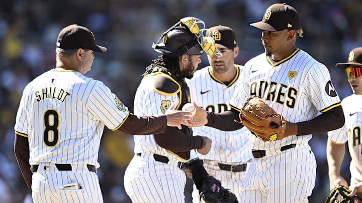 Mar 28, 2024; San Diego, California, USA; San Diego Padres manager Mike Schildt (8) takes the ball from relief pitcher Jhony Brito (76) during the seventh inning against the San Francisco Giants at Petco Park. Mandatory Credit: Orlando Ramirez-Imagn Images