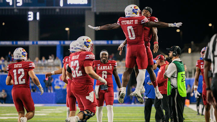 Aug 29, 2025; Lawrence, Kansas, USA; Kansas Jayhawks running back Harry Stewart III (0) and Kansas Jayhawks quarterback Isaiah Marshall (8) celebrate after a touchdown during the second half against the Wagner Seahawks at David Booth Kansas Memorial Stadium. Mandatory Credit: William Purnell-Imagn Images