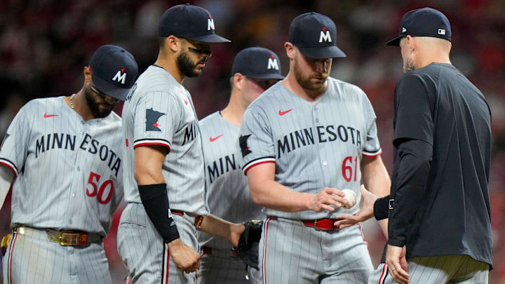 Minnesota Twins pitcher Brock Stewart (61) is pulled by manager Rocco Baldelli (5) in the sixth inning of the MLB interleague game between the Cincinnati Reds and the Minnesota Twins at Great American Ball Park in downtown Cincinnati on Tuesday, June 17, 2025. The Reds won 6-5.