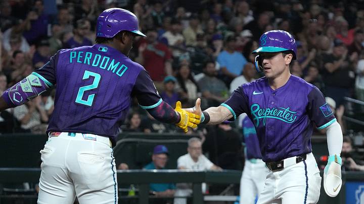 Aug 21, 2026; Phoenix, Arizona, USA; Arizona Diamondbacks right fielder Corbin Carroll (7) celebrates with shortstop Geraldo Perdomo (2) after scoring a run against the Cincinnati Reds in the first inning at Chase Field. Mandatory Credit: Rick Scuteri-Imagn Images Aug 21, 2026; Phoenix, Arizona, USA; Arizona Diamondbacks right fielder Corbin Carroll (7) celebrates with shortstop Geraldo Perdomo (2) after scoring a run against the Cincinnati Reds in the first inning at Chase Field. Mandatory Credit: Rick Scuteri-Imagn Images