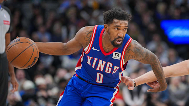 Nov 27, 2024; Minneapolis, Minnesota, USA; Sacramento Kings guard Malik Monk (0) dribbles against the Minnesota Timberwolves in the third quarter at Target Center. Mandatory Credit: Brad Rempel-Imagn Images