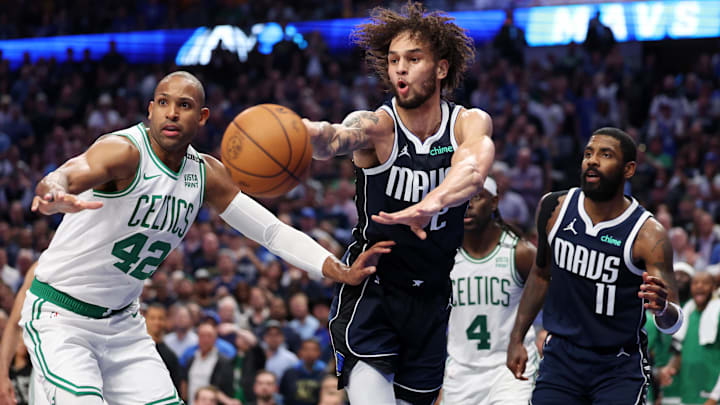 Jun 12, 2024; Dallas, Texas, USA; Dallas Mavericks center Dereck Lively II (2) passes the ball against Boston Celtics center Al Horford (42) during the fourth quarter during game three of the 2024 NBA Finals at American Airlines Center. 