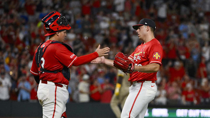Jul 25, 2025; St. Louis, Missouri, USA;  St. Louis Cardinals relief pitcher Ryan Helsley (56) celebrates with catcher Yohel Pozo (63) after the Cardinals defeated the San Diego Padres at Busch Stadium. Mandatory Credit: Jeff Curry-Imagn Images