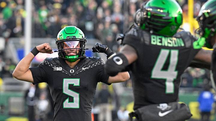 Nov 22, 2025; Eugene, Oregon, USA; Oregon Ducks quarterback Dante Moore (5) celebrates after scoring a touchdown against the Southern California Trojans during the second half at Autzen Stadium. Mandatory Credit: Troy Wayrynen-Imagn Images