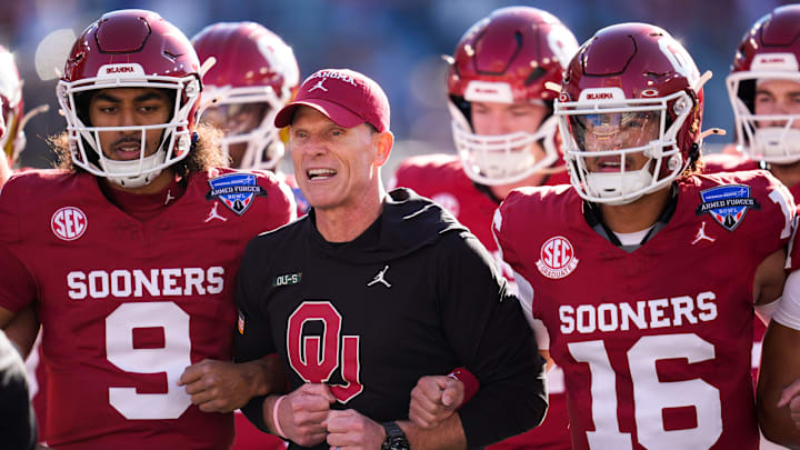 Oklahoma coach Brent Venables locks arms with players before the Armed Forces Bowl. Oklahoma coach Brent Venables locks arms with players before the Armed Forces Bowl.
