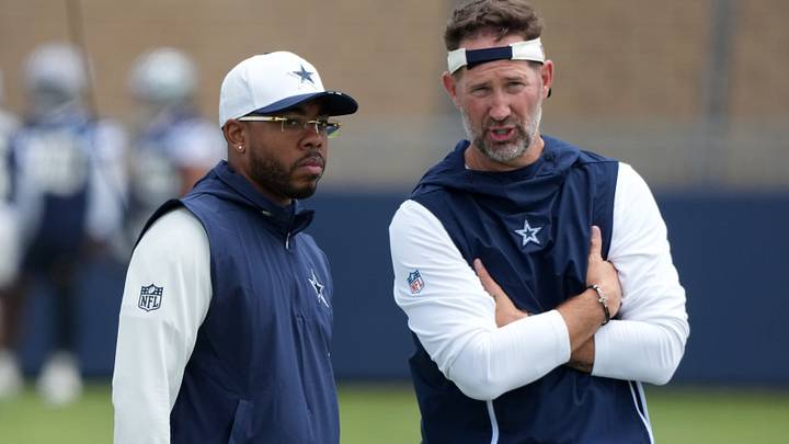 Dallas Cowboys defensive coordinator Christian Parker (left) with head coach Brian Schottenheimer at training camp at River Ridge Playing Fields. Dallas Cowboys defensive coordinator Christian Parker (left) with head coach Brian Schottenheimer at training camp at River Ridge Playing Fields.