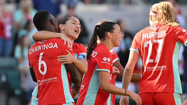 Kansas City Current forward Temwa Chawinga (6) celebrates with teammates after scoring a goal during the second half against San Diego Wave FC at CPKC Stadium 