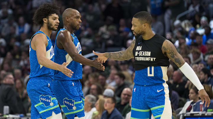 Nov 24, 2023; Milwaukee, Wisconsin, USA; Milwaukee Bucks guard Damian Lillard (0) celebrates with forward Khris Middleton (22) and guard Andre Jackson Jr. (44) during the second quarter at Fiserv Forum. Mandatory Credit: Jeff Hanisch-Imagn Images Nov 24, 2023; Milwaukee, Wisconsin, USA; Milwaukee Bucks guard Damian Lillard (0) celebrates with forward Khris Middleton (22) and guard Andre Jackson Jr. (44) during the second quarter at Fiserv Forum. Mandatory Credit: Jeff Hanisch-Imagn Images
