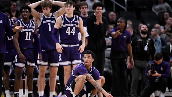 Dec 20, 2025; Indianapolis, Indiana, USA; Northwestern Wildcats guard K.J. Windham (24) reacts after a play during the second half against the Butler Bulldogs at Gainbridge Fieldhouse. Mandatory Credit: Robert Goddin-Imagn Images