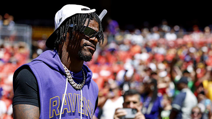 Aug 23, 2025; Landover, Maryland, USA; Baltimore Ravens quarterback Lamar Jackson (8) walks on the field before the game against the Washington Commanders at Northwest Stadium. Mandatory Credit: Peter Casey-Imagn Images
