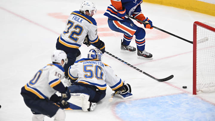 Apr 9, 2025; Edmonton, Alberta, CAN; St. Louis Blues goalie Jordan Binnington (50), defenseman Justin Faulk  (72) and center Brayden Schenn( 10) watch as Edmonton Oilers center Connor McDavid (97) skates past during the third period at Rogers Place. Mandatory Credit: Walter Tychnowicz-Imagn Images