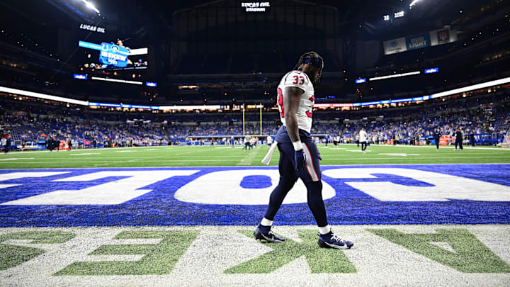 Jan 6, 2024; Indianapolis, Indiana, USA; Houston Texans running back Dare Ogunbowale (33) walks on the field before a game against the Indianapolis Colts at Lucas Oil Stadium.