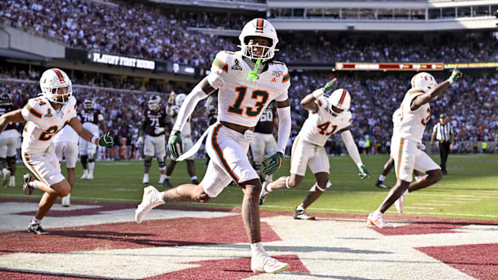 Dec 20, 2025; College Station, TX, USA;  Miami Hurricanes defensive back Bryce Fitzgerald (13) celebrates after he intercepts a Texas A&M Aggies pass to clinch the Miami win at Kyle Field. Mandatory Credit: Jerome Miron-Imagn Images