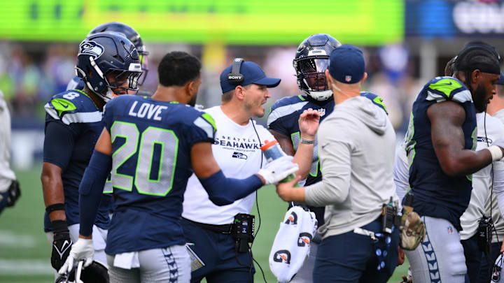 Sep 7, 2025; Seattle, Washington, USA; Seattle Seahawks head coach Michael Macdonald huddles up during the second half against San Francisco 49ers at Lumen Field. Mandatory Credit: Steven Bisig-Imagn Images