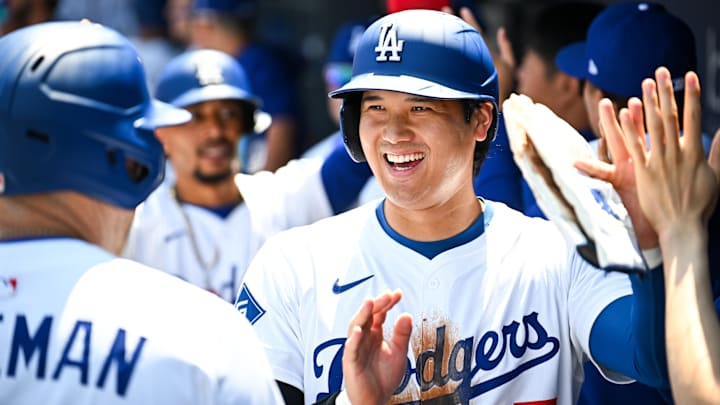 Aug 17, 2025; Los Angeles, California, USA; Los Angeles Dodgers designated hitter Shohei Ohtani (17) celebrates after first baseman Freddie Freeman (5) hits a three run home run in the first inning against the San Diego Padres at Dodger Stadium. Mandatory Credit: Jonathan Hui-Imagn Images