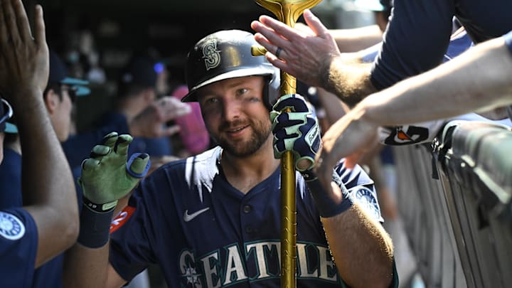 Seattle Mariners catcher Cal Raleigh celebrates after hitting a home run against the Chicago Cubs on June 20 at Wrigley Field. Seattle Mariners catcher Cal Raleigh celebrates after hitting a home run against the Chicago Cubs on June 20 at Wrigley Field.