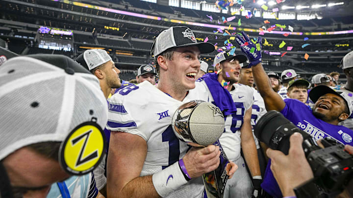 Dec 3, 2022; Arlington, TX, USA; Kansas State Wildcats quarterback Will Howard (18) holds up the championship trophy as the Wildcats celebrate winning the Big 12 championship after defeating the TCU Horned Frogs overtime at AT&T Stadium. Mandatory Credit: Jerome Miron-Imagn Images