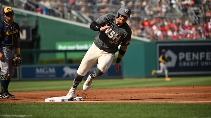 Washington Nationals second baseman Travis Blankenhorn (33) rounds third base to score a run against the Milwaukee Brewers during the first inning at Nationals Park on Aug. 3, 2024.