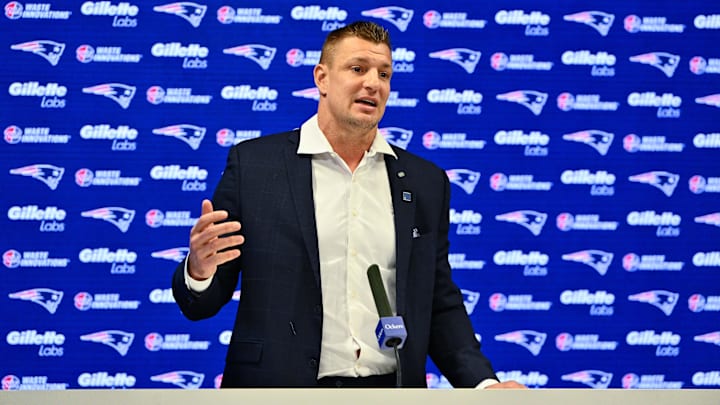 Nov 12, 2025; Foxborough, MA, USA; New England Patriots former player and current Fox Sports football analyst Rob Gronkowski speaks during a press conference where he signed a ceremonial one day contract at Gillette Stadium. Mandatory Credit: Eric Canha-Imagn Images Nov 12, 2025; Foxborough, MA, USA; New England Patriots former player and current Fox Sports football analyst Rob Gronkowski speaks during a press conference where he signed a ceremonial one day contract at Gillette Stadium. Mandatory Credit: Eric Canha-Imagn Images