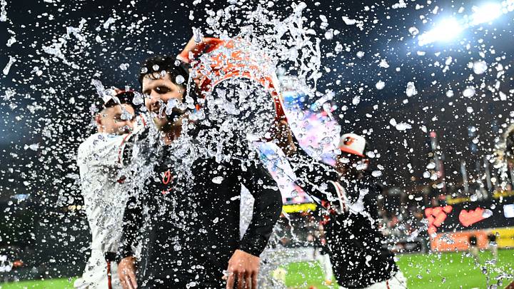 Aug 22, 2026; Baltimore, Maryland, USA;  Baltimore Orioles right fielder Dylan Beavers (12) is doused with water after hitting a walk off RBI double during the tenth inning against the Tampa Bay Rays at Oriole Park at Camden Yards.  Mandatory Credit: James A. Pittman-Imagn Images