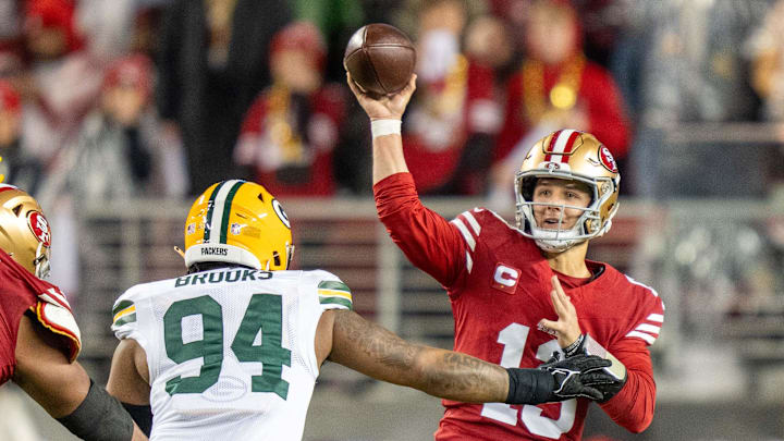 San Francisco 49ers quarterback Brock Purdy is pressured by Karl Brooks during last year's playoff game vs. the Packers.