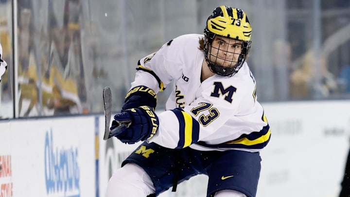 Mar 7, 2025; Ann Arbor, MI, USA;  Michigan Wolverines forward T.J. Hughes (13) passes against Penn State  during a Big Ten Tournament quarter final game at Yost Arena. Mandatory Credit: Rick Osentoski-Imagn Images