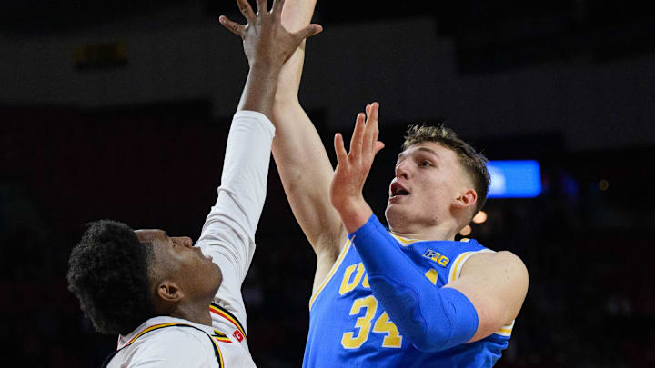 Jan 10, 2025; College Park, Maryland, USA; UCLA Bruins forward Tyler Bilodeau (34) takes a shot as Maryland Terrapins center Derik Queen (25) defends during the first half at Xfinity Center. Mandatory Credit: Reggie Hildred-Imagn Images Jan 10, 2025; College Park, Maryland, USA; UCLA Bruins forward Tyler Bilodeau (34) takes a shot as Maryland Terrapins center Derik Queen (25) defends during the first half at Xfinity Center. Mandatory Credit: Reggie Hildred-Imagn Images
