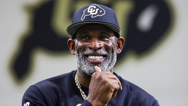 Colorado Buffaloes head coach Deion Sanders watches as his players go through drills at the University of Colorado NFL Showcase at the CU Indoor Practice Facility. 
