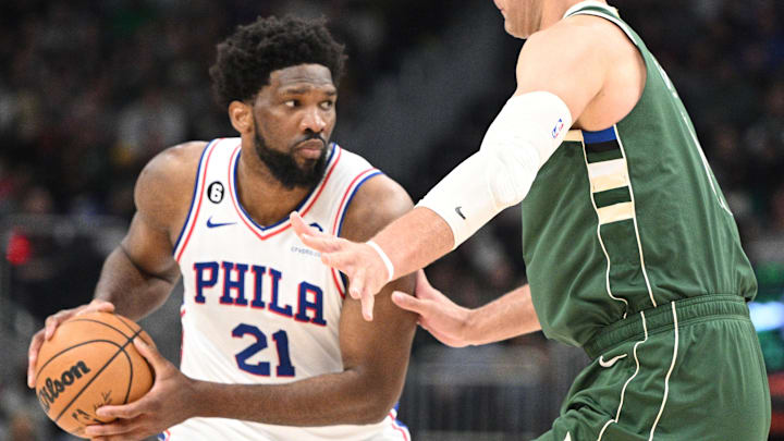 Mar 4, 2023; Milwaukee, Wisconsin, USA; Philadelphia 76ers center Joel Embiid (21) looks for a shot against Milwaukee Bucks center Brook Lopez (11) in the second  half at Fiserv Forum. Mandatory Credit: Michael McLoone-Imagn Images