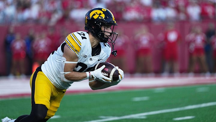 Oct 11, 2025; Madison, Wisconsin, USA; Iowa Hawkeyes wide receiver Kaden Wetjen (21) takes the opening kickoff during the first half against the Wisconsin Badgers at Camp Randall Stadium. Mandatory Credit: Ross Harried-Imagn Images
