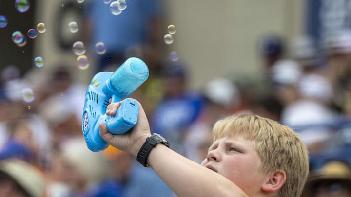 May 23, 2024; Hoover, AL, USA; A fan of the Tennessee Volunteers blows some bubbles during a game between the Volunteers and the Texas A&M Aggies during the SEC Baseball Tournament at Hoover Metropolitan Stadium. Mandatory Credit: Vasha Hunt-USA TODAY Sports