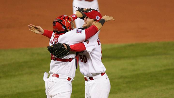 Oct 27, 2006; St. Louis, MO, USA; St. Louis Cardinals pitcher Adam Wainwright celebrates with catcher Yadier Molina after defeating the Detroit Tigers 4-2 during game 5 of the World Series to win the series 4 games to 1 at Busch Stadium in St. Louis, Missouri. Mandatory Credit: Jerry Lai-USA TODAY Sports Copyright © 2006 Jerry Lai