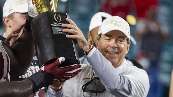 Jan 11, 2021; Miami Gardens, Florida, USA; Alabama Crimson Tide head coach Nick Saban celebrates with the trophy after defeating the Ohio State Buckeyes in the 2021 College Football Playoff National Championship Game. Jan 11, 2021; Miami Gardens, Florida, USA; Alabama Crimson Tide head coach Nick Saban celebrates with the trophy after defeating the Ohio State Buckeyes in the 2021 College Football Playoff National Championship Game.