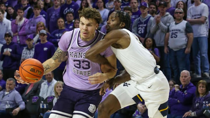 Jan 25, 2025; Manhattan, Kansas, USA; Kansas State Wildcats forward Coleman Hawkins (33) is guarded by West Virginia Mountaineers guard Toby Okani (5) during the first half at Bramlage Coliseum. Mandatory Credit: Scott Sewell-Imagn Images Jan 25, 2025; Manhattan, Kansas, USA; Kansas State Wildcats forward Coleman Hawkins (33) is guarded by West Virginia Mountaineers guard Toby Okani (5) during the first half at Bramlage Coliseum. Mandatory Credit: Scott Sewell-Imagn Images