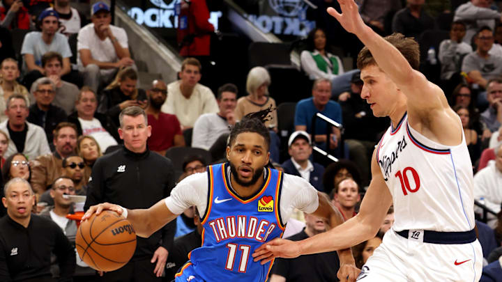 Mar 23, 2025; Inglewood, California, USA; Oklahoma City Thunder guard Isaiah Joe (11) drives against LA Clippers guard Bogdan Bogdanovic (10) during the 4th quarter at Intuit Dome. Mandatory Credit: Jason Parkhurst-Imagn Images Mar 23, 2025; Inglewood, California, USA; Oklahoma City Thunder guard Isaiah Joe (11) drives against LA Clippers guard Bogdan Bogdanovic (10) during the 4th quarter at Intuit Dome. Mandatory Credit: Jason Parkhurst-Imagn Images