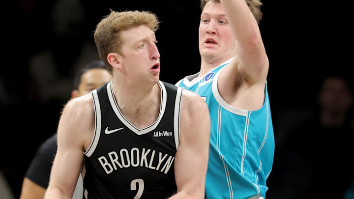 Dec 1, 2025; Brooklyn, New York, USA; Brooklyn Nets forward Danny Wolf (2) looks to pass the ball against Charlotte Hornets guard Kon Knueppel (7) during the first quarter at Barclays Center. Mandatory Credit: Brad Penner-Imagn Images