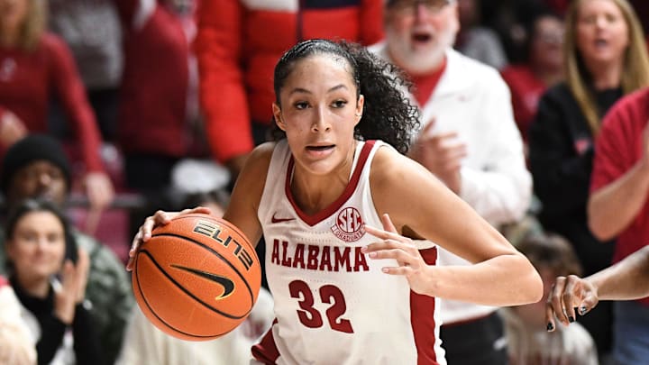 Alabama Crimson Tide guard Aaliyah Nye (32) drives the baseline at Coleman Coliseum. 