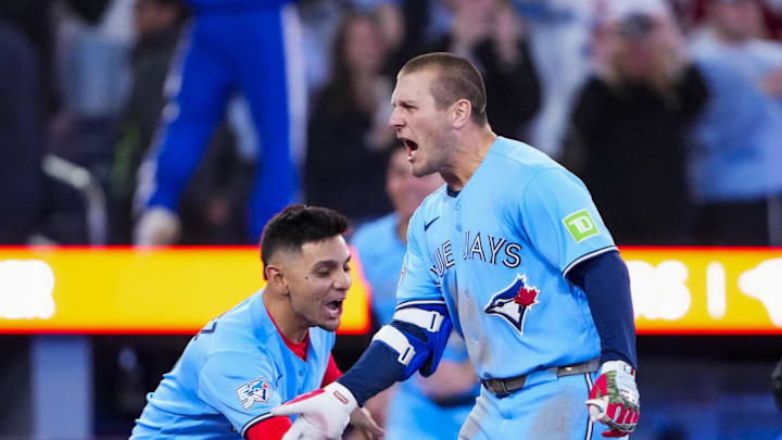 May 13, 2026; Toronto, Ontario, CAN;  Toronto Blue Jays center fielder Daulton Varsho (5) celebrates hitting a grand slam walk off to defeat the Tampa Bay Rays during the tenth inning at Rogers Centre. Mandatory Credit: Kevin Sousa-Imagn Images