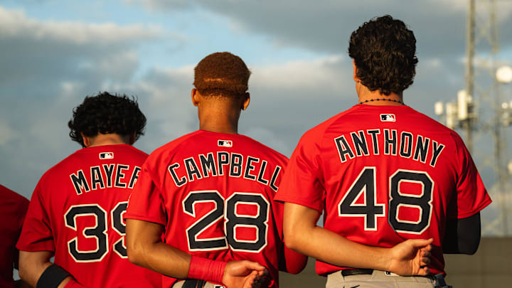Boston's top-three prospects in Marcelo Mayer, Kristian Campbell and Roman Anthony stand for the national anthem ahead of a Spring Training breakout game on March 13, 2025.