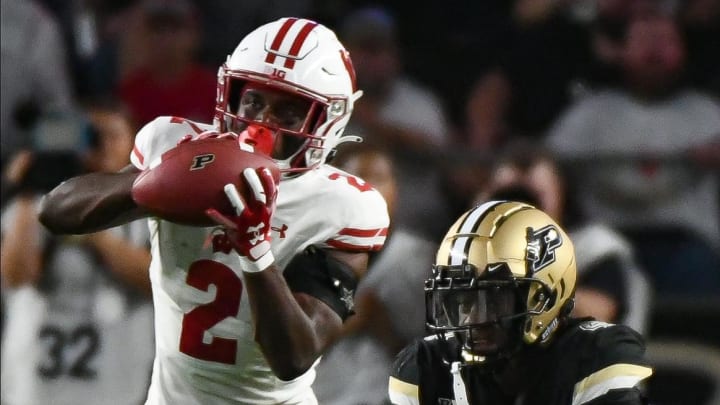 Sep 22, 2023; West Lafayette, Indiana, USA; Wisconsin Badgers cornerback Ricardo Hallman (2) intercepts a pass against Purdue Boilermakers wide receiver Deion Burks (4) during the second half at Ross-Ade Stadium. Mandatory Credit: Robert Goddin-USA TODAY Sports Sep 22, 2023; West Lafayette, Indiana, USA; Wisconsin Badgers cornerback Ricardo Hallman (2) intercepts a pass against Purdue Boilermakers wide receiver Deion Burks (4) during the second half at Ross-Ade Stadium. Mandatory Credit: Robert Goddin-USA TODAY Sports