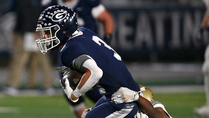 Greenwood's Grant Karnes (3) tries to break free from the tackle of Pulaski Academy's KJ Colen during the 6A West Conference game on Oct. 28 at Smith Robinson Stadium.